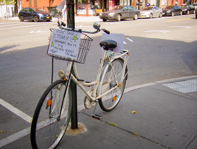 Photo of 'stoop sale' sign on bicycle